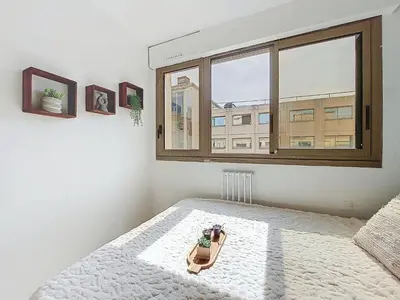 a bedroom with a toy train on a bed with a window at Apartment Le Nice Etoile by Interhome in Nice