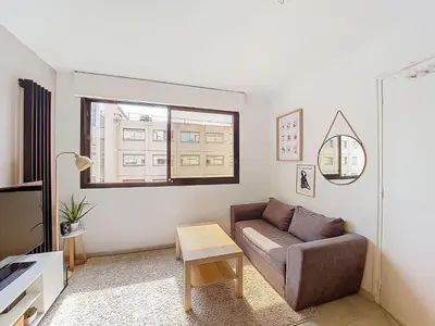 a living room with a couch and a window at Apartment Le Nice Etoile by Interhome in Nice