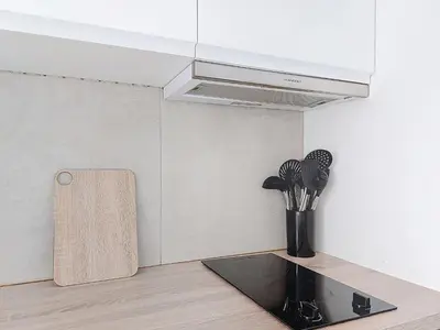 a kitchen with a counter with a vent and a vase at Apartment Le Nice Etoile by Interhome in Nice