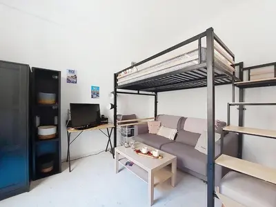 a living room with a couch and a bunk bed at Apartment Le Gambetta by Interhome in Nice