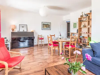 a living room with a table and chairs at Apartment L'Helios by Interhome in Nice
