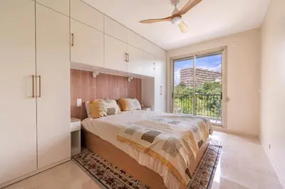 a bedroom with a large bed and a window at Le rêve bleu in Nice