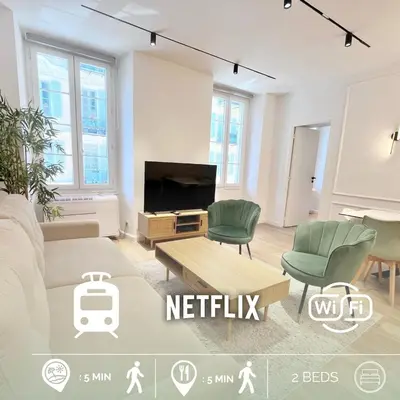 a living room with a couch and chairs and a tv at RF104 - Charmant 3P à nice près du Port in Nice