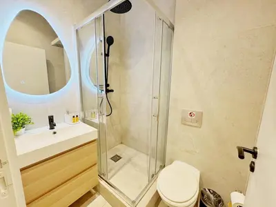 a bathroom with a shower with a toilet and a sink at RF104 - Charmant 3P à nice près du Port in Nice
