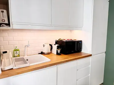 a kitchen counter with a microwave and a sink at RF107 - Moderne 3P Nice Port Place du Pin in Nice