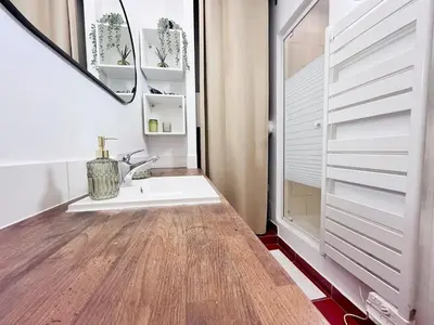 a bathroom with a sink and a mirror at RF109 - Spacieux 4P au cœur de Nice in Nice