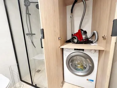 a washing machine with a red toy car on a shelf at RF112 - T3 Lumineux à deux pas du port in Nice