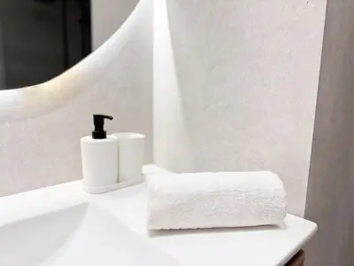 a white sink with a soap dispenser and a towel at RF112 - T3 Lumineux à deux pas du port in Nice