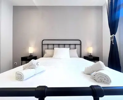a large white bed with two towels on it at RF101- Magnifique 3 pièces centre Nice in Nice