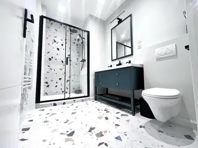 a bathroom with a toilet and a shower with a blue cabinet at RF101- Magnifique 3 pièces centre Nice in Nice