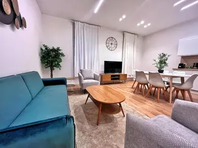a living room with a couch and a table at RF102 - Magnifique et spacieux 3 pièces in Nice