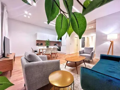 a living room with a couch and a table at RF102 - Magnifique et spacieux 3 pièces in Nice