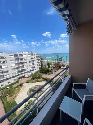 a balcony with chairs and a view of the ocean at Sea view apartment in Cagnes-sur-Mer