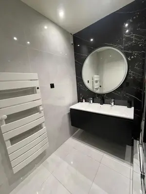 a bathroom with a sink and a mirror at Sea view apartment in Cagnes-sur-Mer
