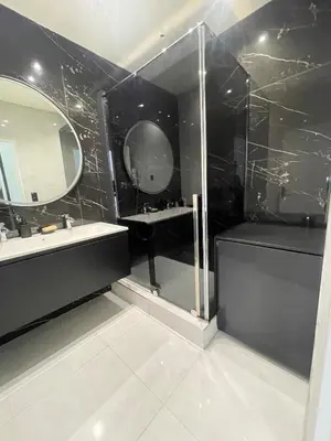 a black bathroom with a sink and a mirror at Sea view apartment in Cagnes-sur-Mer