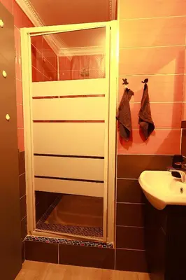 a bathroom with a shower and a sink at AERO Nice in Nice