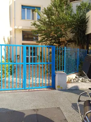 a tiled floor in front of a building at Charmant T2 proche tramway et plages in Nice