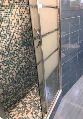 a shower with a glass door in a bathroom at Appart Le Carré D'Or in Nice