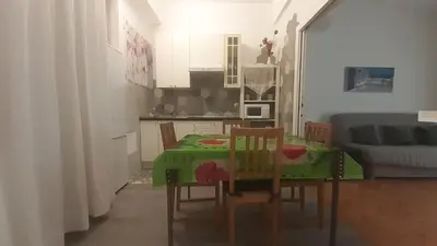 a small kitchen with a table and chairs in a room at Apartment Palais de Coppet in Nice
