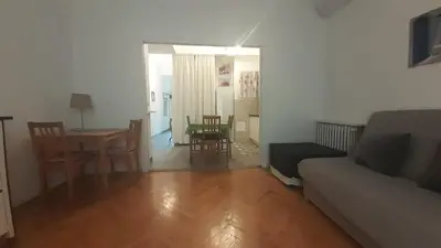 a living room with a couch and a table at Apartment Palais de Coppet in Nice