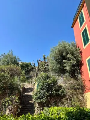 a set of stairs next to a red building at Elegant apartment, Cap de Nice in Nice