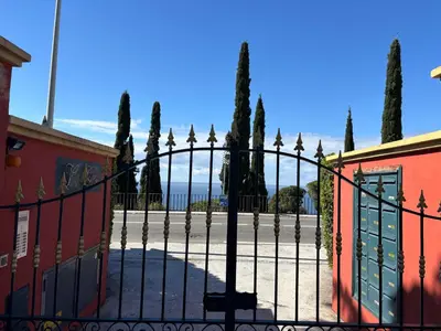 a wrought iron fence with trees in the background at Elegant apartment, Cap de Nice in Nice