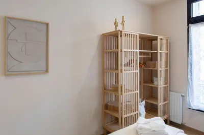 a room with a wooden book shelf in a room at #52 Etoile Suite ,Central, Balcony, AC-5 min P Massena in Nice