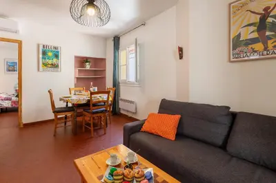 a living room with a couch and a table at VUE ROSSETTI AP4465 by Riviera Holiday Homes in Nice