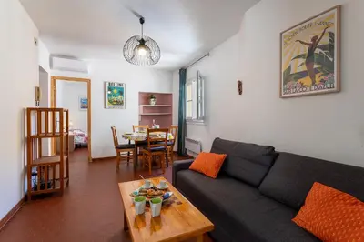 a living room with a couch and a table at VUE ROSSETTI AP4465 by Riviera Holiday Homes in Nice