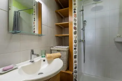 a bathroom with a sink and a shower at VUE ROSSETTI AP4465 by Riviera Holiday Homes in Nice
