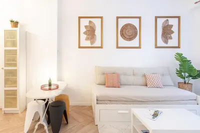 a white room with a bed and a table at #55 Sun terrace AC & Wifi 10mins walk to Sea & oldtown in Nice