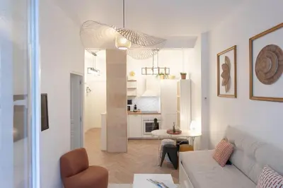 a living room with a couch and a kitchen at #55 Sun terrace AC & Wifi 10mins walk to Sea & oldtown in Nice