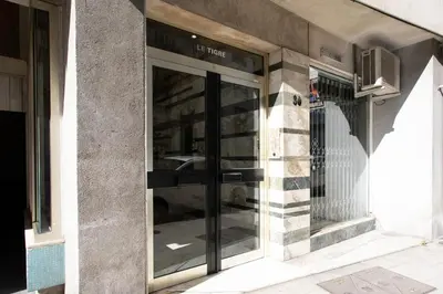 a store front with glass doors on a building at #55 Sun terrace AC & Wifi 10mins walk to Sea & oldtown in Nice
