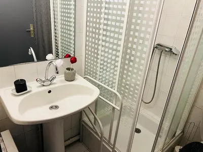 a bathroom with a sink and a shower at Magnan et ses plages de la Promenade des Anglais in Nice