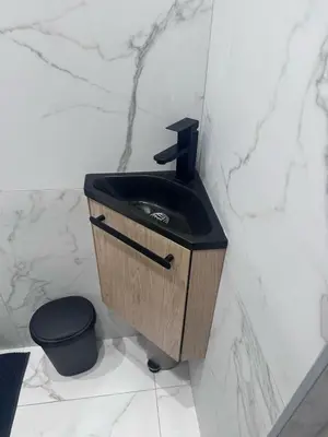 a bathroom with a black sink and a toilet at Beautiful and super central in Nice