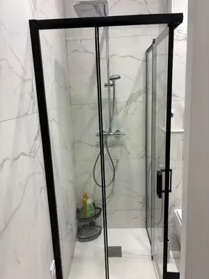 a shower with a glass door in a bathroom at Beautiful and super central in Nice