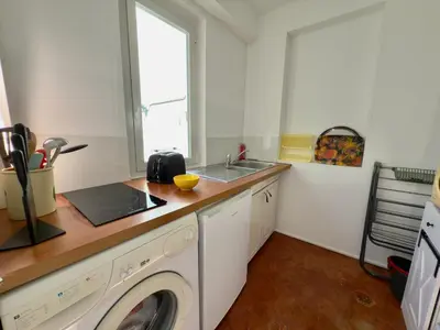 a kitchen with a washing machine and a sink at Ze Perfect Place - Authentique & Calme - 1 CHB in Nice