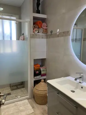 a bathroom with a sink and a mirror at Chambre de charme in Nice