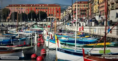 a bunch of boats docked in a harbor with buildings at A Studio at Nice Beach in Nice