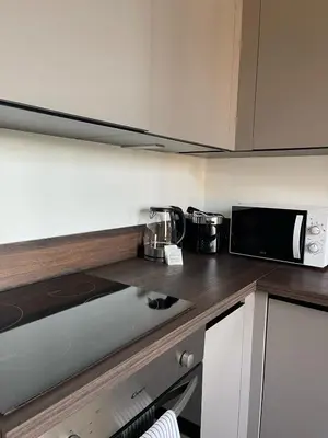 a kitchen with a counter top with a microwave at Duplex Place Garibaldi - Close to port, Old Nice in Nice
