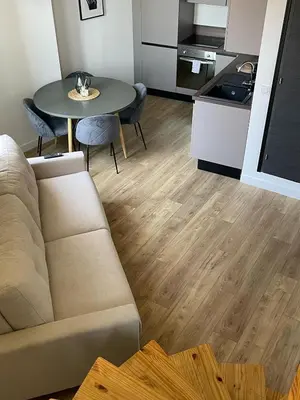 a living room with a couch and a table at Duplex Place Garibaldi - Close to port, Old Nice in Nice