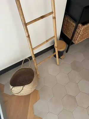 a room with a chair and a basket on the floor at Duplex Place Garibaldi - Close to port, Old Nice in Nice