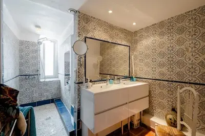 a bathroom with a sink and a mirror at Guest bedroom in private home, quiet, elegant, 10 mins to beach, 1 triple and 1 double bedrooms in Nice