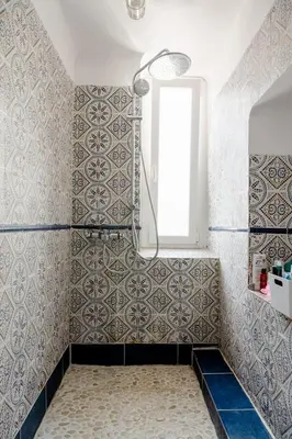 a bathroom with a shower with a window and tiles at Guest bedroom in private home, quiet, elegant, 10 mins to beach, 1 triple and 1 double bedrooms in Nice