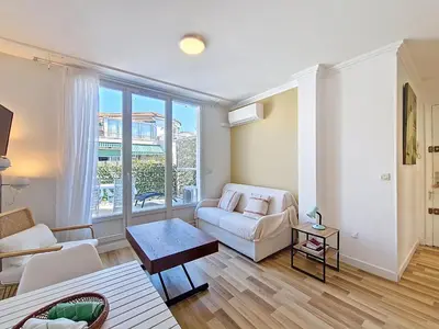 a living room with a couch and a table at Nestor&Jeeves - CASA SOLANA - Terrace - Central in Nice