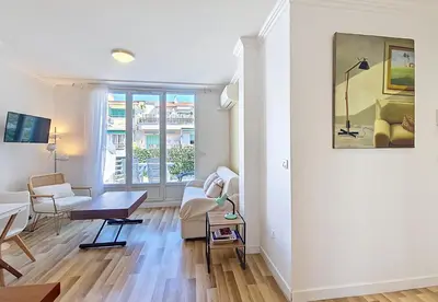 a living room with a couch and a table at Nestor&Jeeves - CASA SOLANA - Terrace - Central in Nice