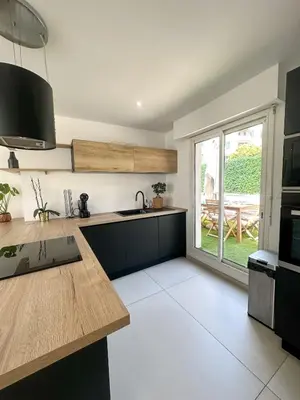 a kitchen with a sink and a counter top at Spacious, quiet apartment in Nice