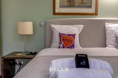 a bedroom with a bed with a pillow on it at Le Rivoli Niçois - 180m2 - 3 Chambres in Nice