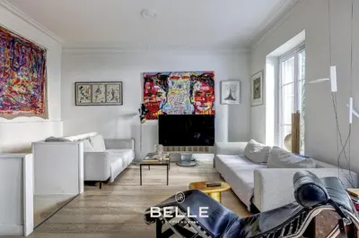 a living room with two couches and a tv at Le Rivoli Niçois - 180m2 - 3 Chambres in Nice