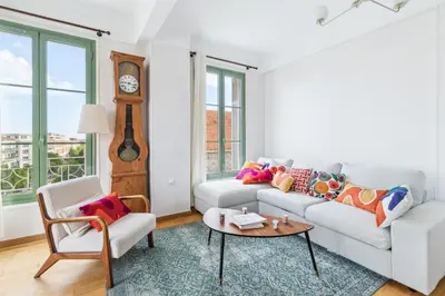 a living room with a couch and a table at Happyfew Cathedrale in Nice